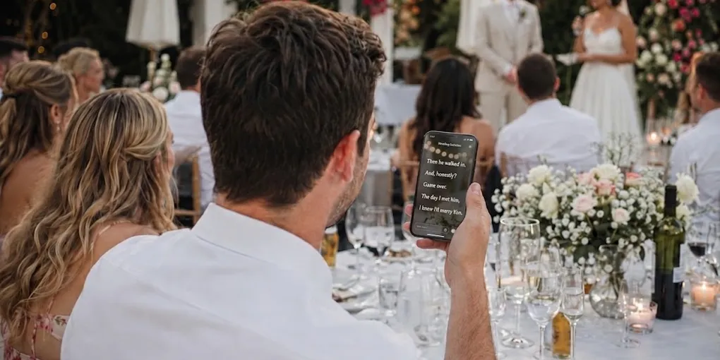 Wedding guest reading live captions on a phone while the couple speaks